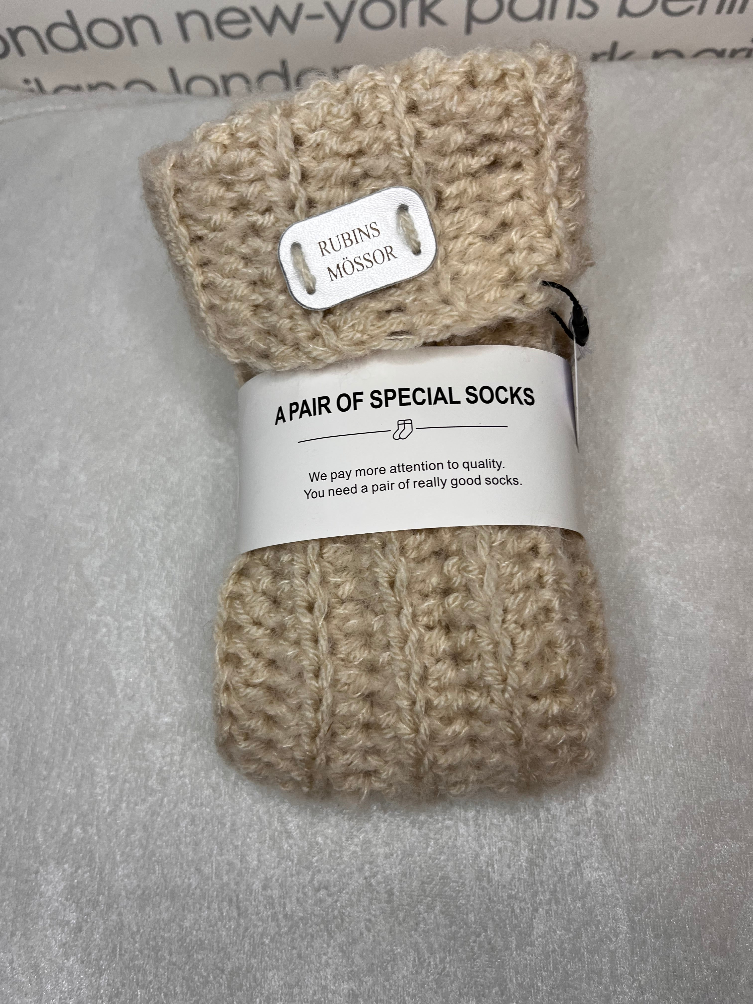 Sockor i ull, polyester, alpacka, silke och akryl